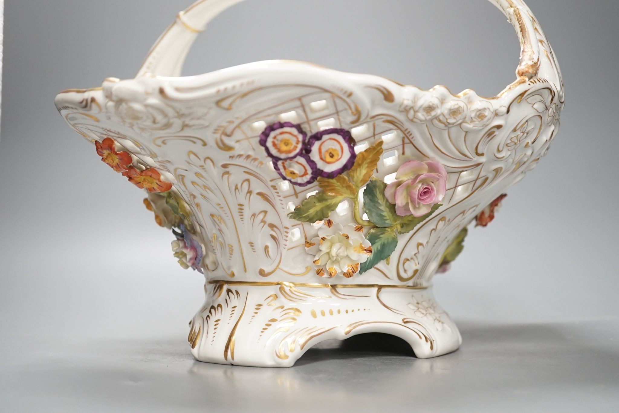 A Dresden porcelain floral encrusted basket 34cm